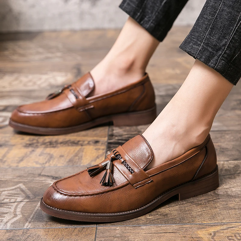 Mocassins en cuir avec pompons