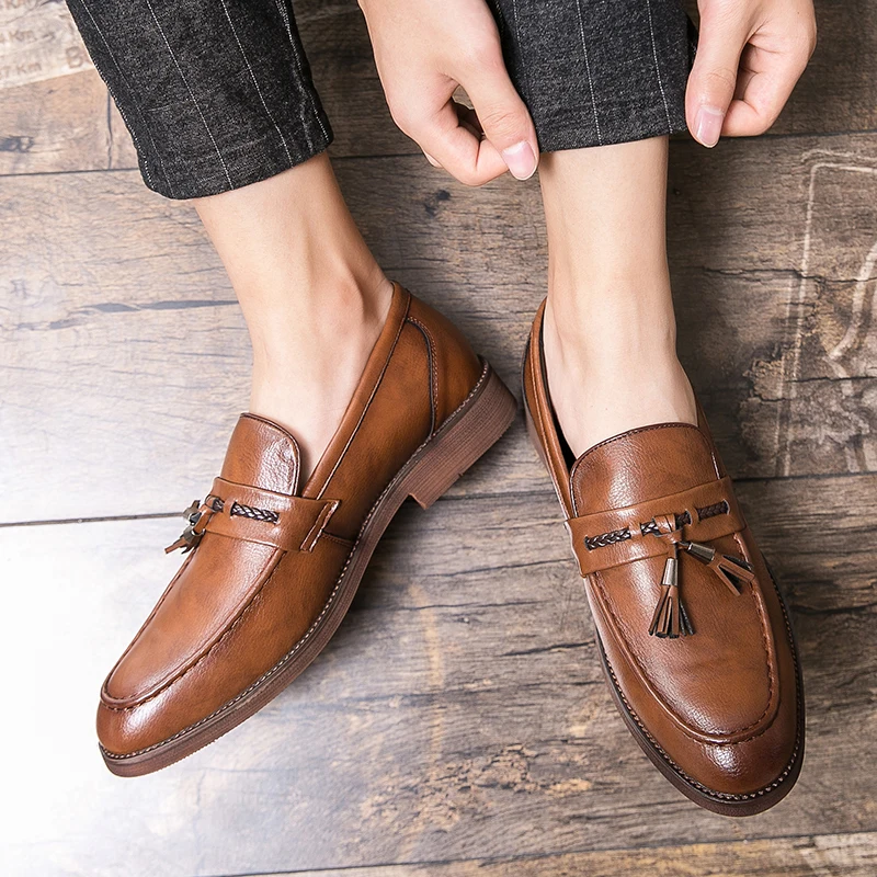 Mocassins en cuir avec pompons