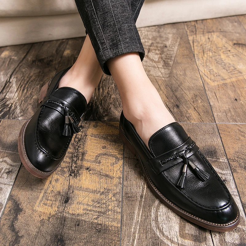 Mocassins en cuir avec pompons