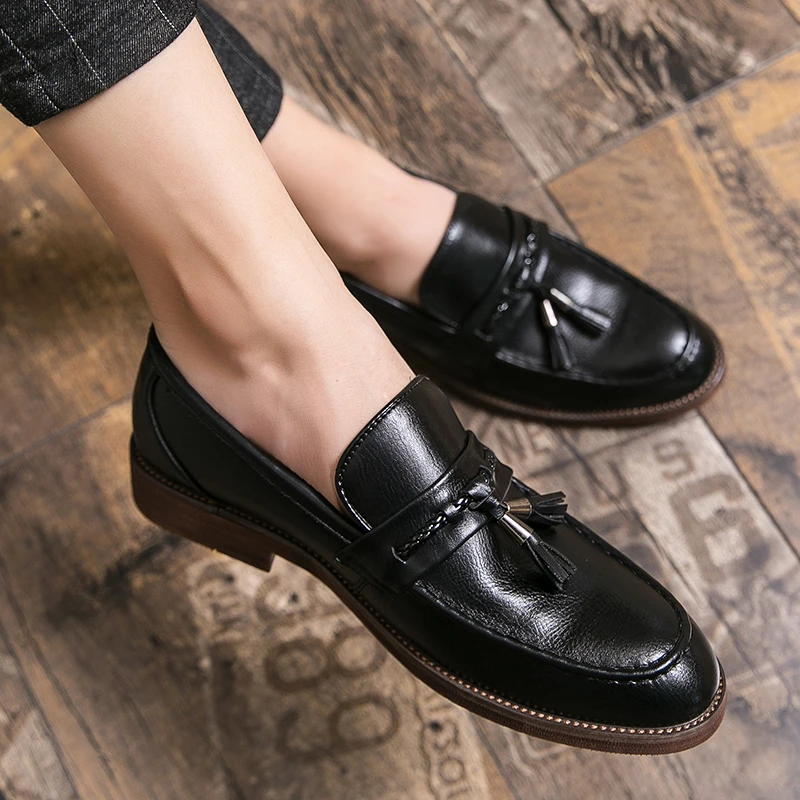 Mocassins en cuir avec pompons