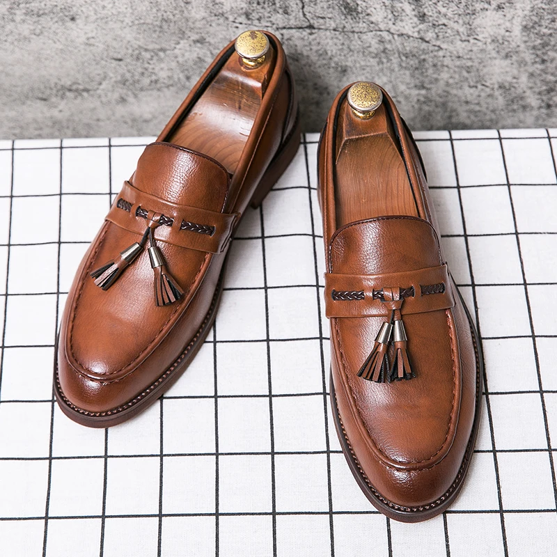 Mocassins en cuir avec pompons
