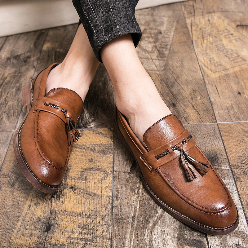 Mocassins en cuir avec pompons