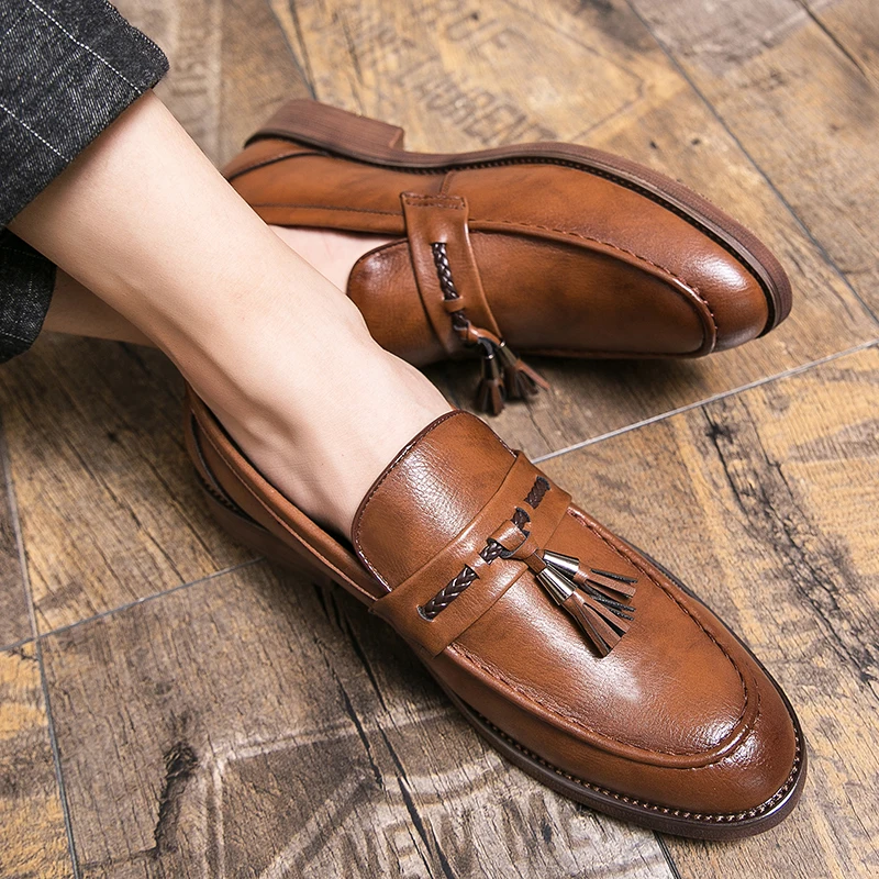 Mocassins en cuir avec pompons