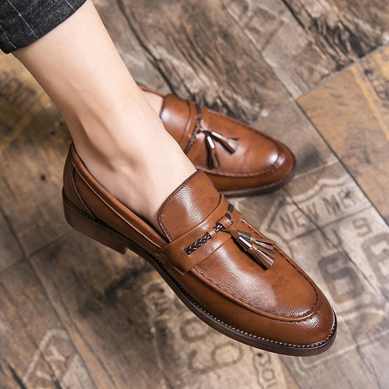 Mocassins en cuir avec pompons