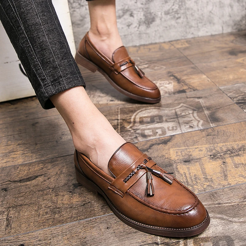 Mocassins en cuir avec pompons