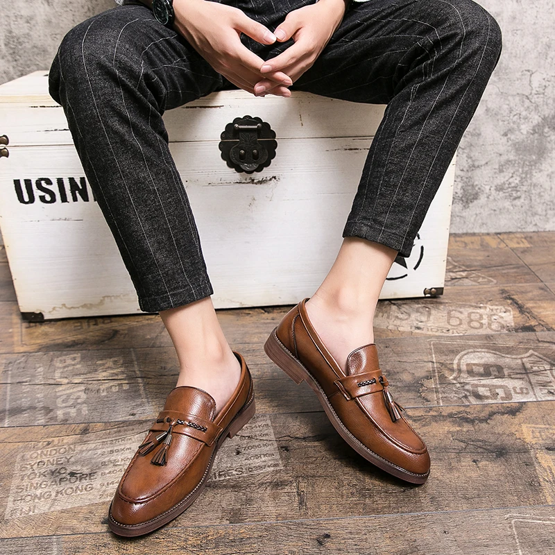 Mocassins en cuir avec pompons