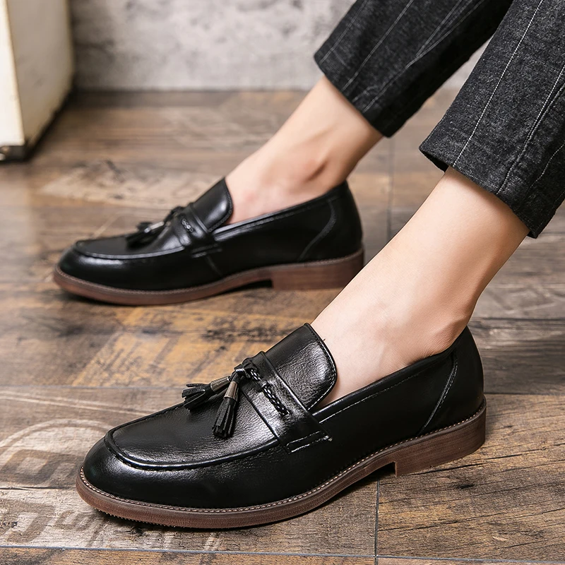 Mocassins en cuir avec pompons