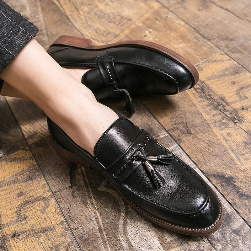 Mocassins en cuir avec pompons