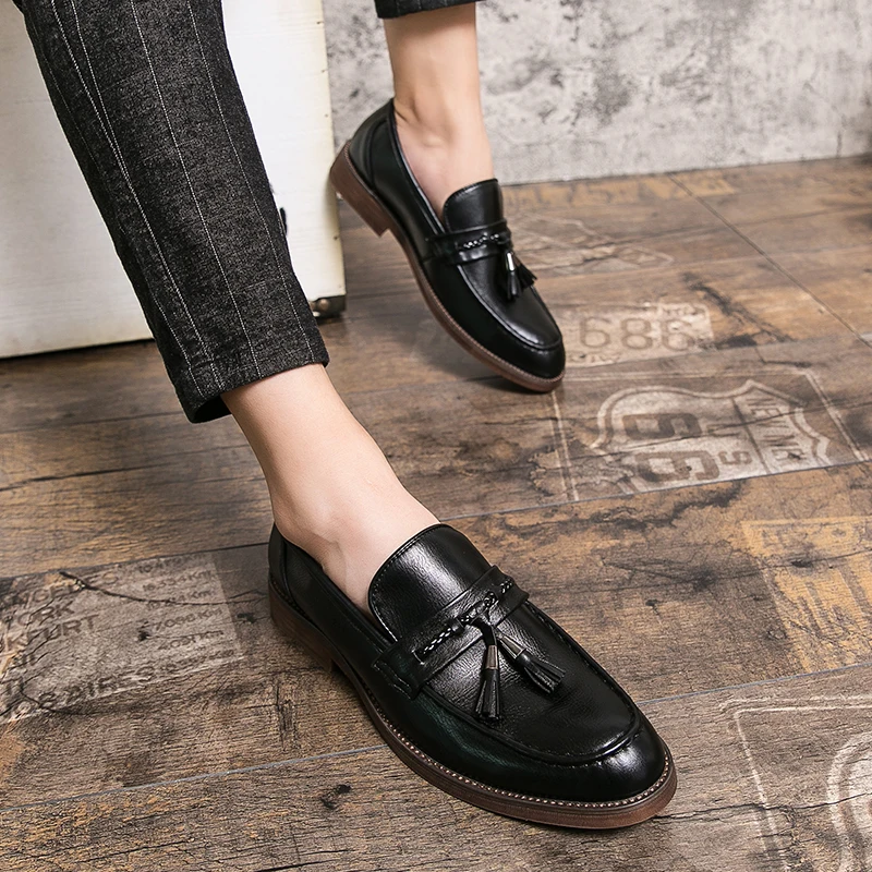 Mocassins en cuir avec pompons