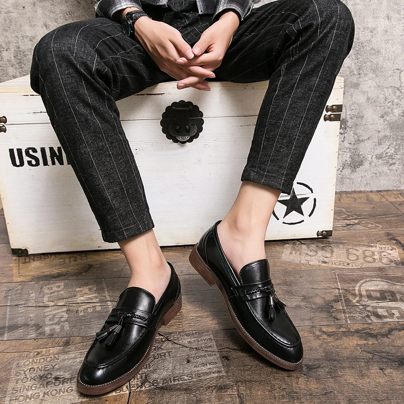 Mocassins en cuir avec pompons
