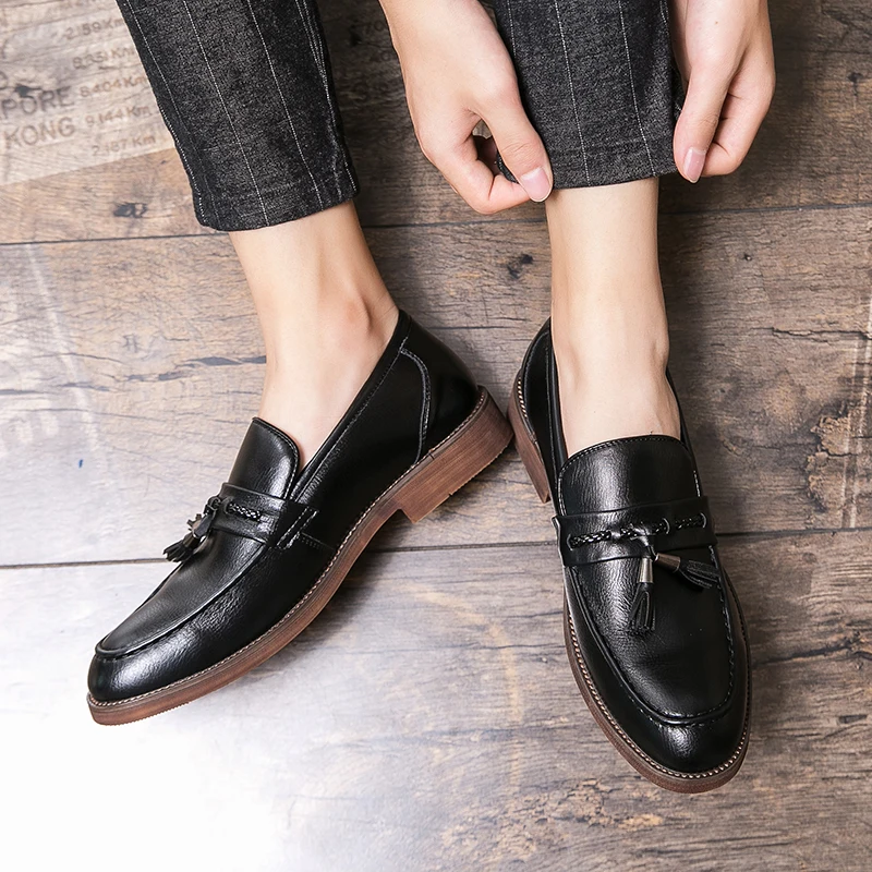 Mocassins en cuir avec pompons