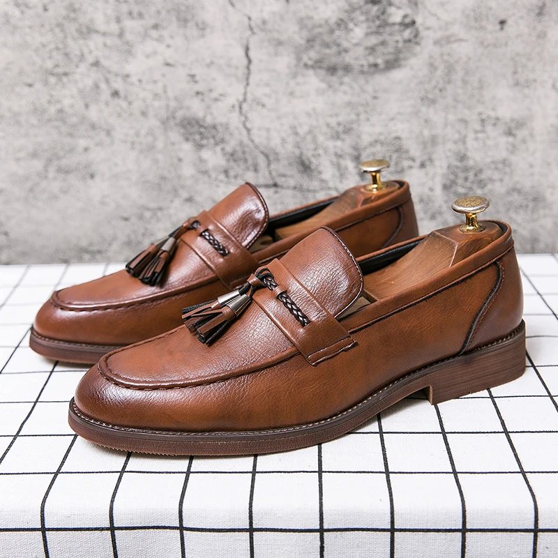 Mocassins en cuir avec pompons