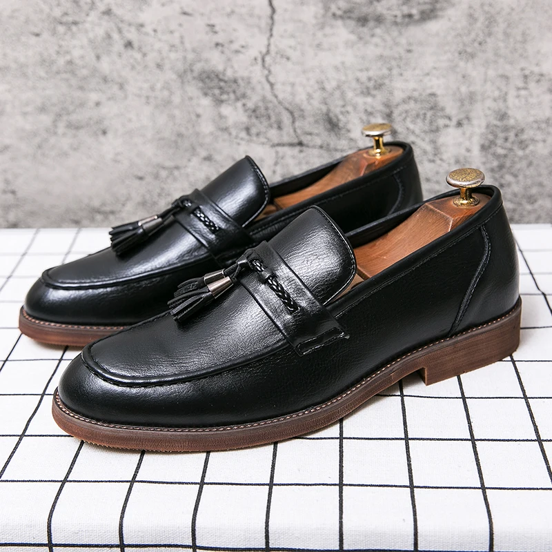 Mocassins en cuir avec pompons