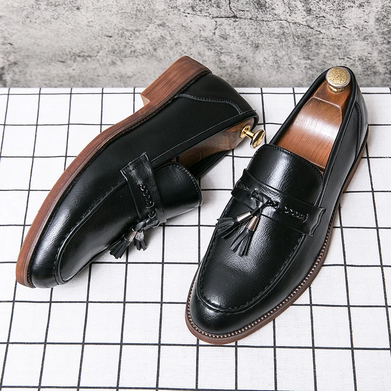 Mocassins en cuir avec pompons