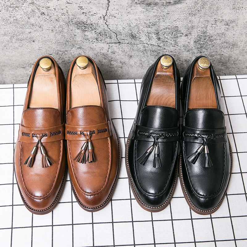 Mocassins en cuir avec pompons